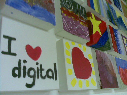wall of school art with "I heart digital" painting